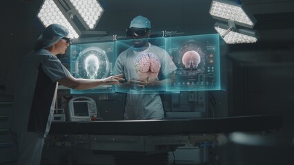 Multiethnic surgeons in AR headsets work in high-tech operating room. Medical professionals using AI virtual holographic display. 3D graphics of health monitors and human organs. Future of healthcare.