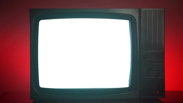Blinking vintage TV against red background, horizontal stripes because of bad satellite signal, old television with interrupted news media transmission, broken retro TV concept