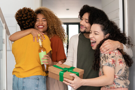 Brazilian couple welcome friends at home - Powered by Adobe