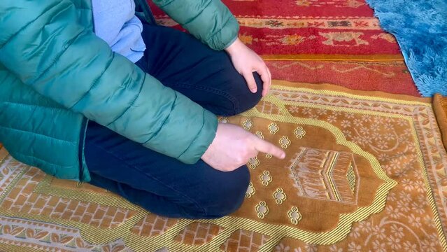 Muslim man praying, muslim man pray  while sitting
