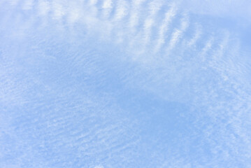 Blue sky and tiny white clouds for background.
