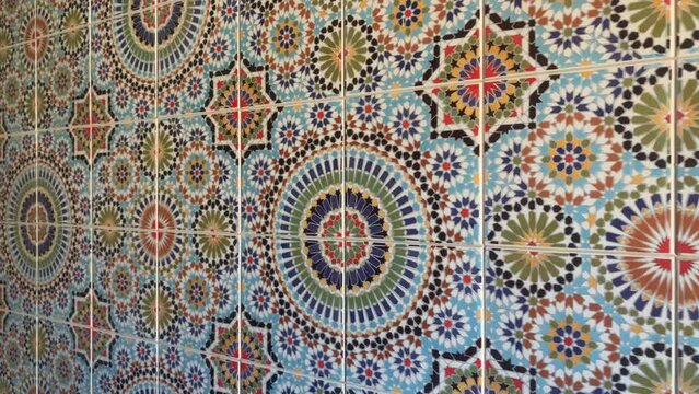 Colorful zellige tiles of a mosque in Morocco. Mosaic pattern, traditional Islamic geometric design. Moroccan craft, handmade. 4k footage.
