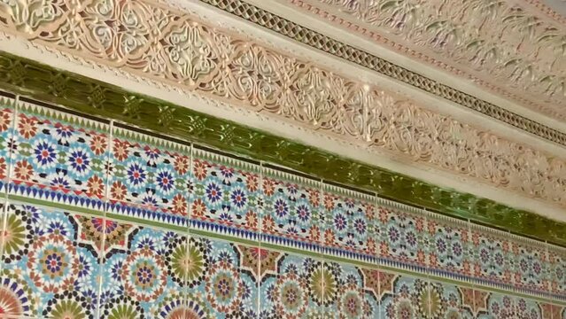 Colorful zellige tiles of a mosque in Morocco. Mosaic pattern, traditional Islamic geometric design. Moroccan craft, handmade. 4k footage.