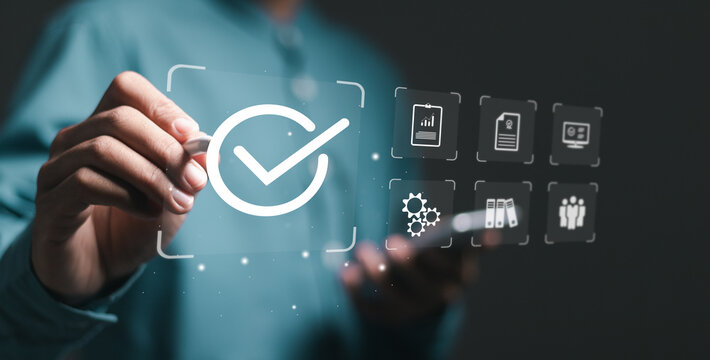 Quality control, Certification and standardization process concept. Businessman use pen touching symbol of the top service Quality assurance on interface screen.