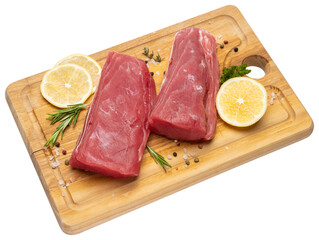 Fresh tuna Fish steak on a wooden cutting serving board isolated