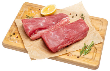 Fresh tuna Fish steak on a wooden cutting serving board isolated