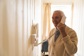 Happy old grandfather at his home.