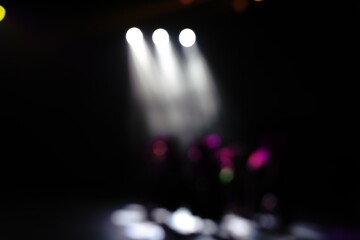 Defocused entertainment concert lighting on stage, blurred disco party and Concert Live.