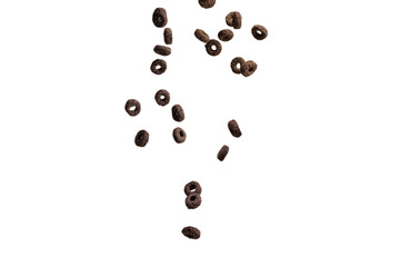 Chocolate rings cereal spill out into a bowl. Breakfast.