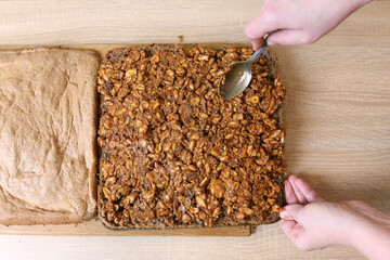A sweet filling of peanuts, cinnamon and chocolate is added to the pastry. Making cakes