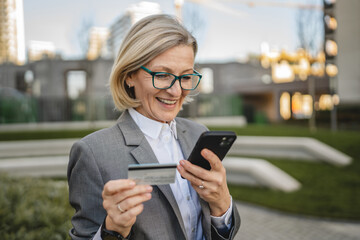 One woman use mobile phone smartphone shopping online in the city