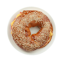 Delicious bagel with ham and cheese isolated on white, top view