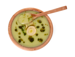 Bowl of delicious leek soup and spoon isolated on white, top view