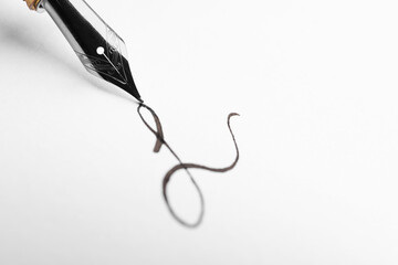 Signing on sheet of paper with fountain pen, closeup. Space for text