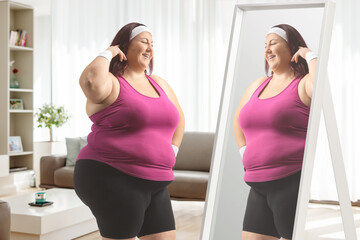 Plus size woman in sportswear looking at a mirror