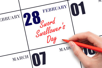 February 28. Hand writing text Sword Swallower's Day on calendar date. Save the date.