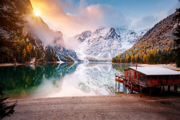 Great view of the mighty rock above peaceful alpine lake Braies. National park Fanes-Sennes-Braies, Italy, Europe.