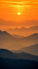 Sunset in the mountains, the mountains are like shadows in the orange sunlight