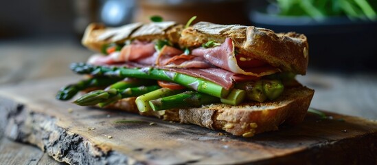 Asparagus and luncheon meat on a hot sandwich.
