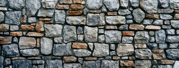 Natural stone wall with mortar close up background