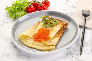 Russian pancake with red caviar