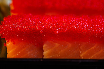 close-up on sushi caviar rolls.