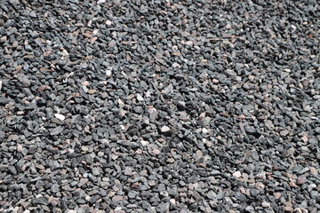 Material for construction. Gray granite stone. Texture of gray and white rocks. Aggregate for...