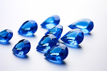 Precious blue sapphire crystals on white background
