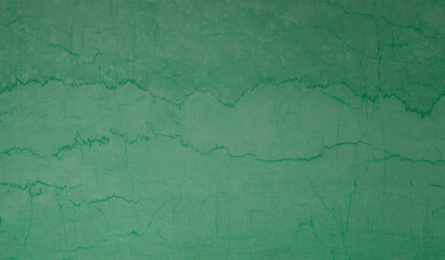 texture of old green wall with cracked paint. background for design.