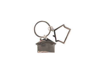 Keychain in the shape of a house with a key ring isolated on a white background. Concepts for real estate and moving home or renting property. Buying a property. Mock-up keychain house shaped.