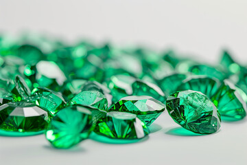Precious green emerald crystals on white background