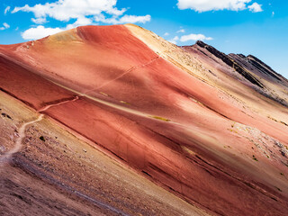 Amazing colors of the Red Valley (valle rojo) with stunning path leading to the top of the mountain, Cusco region, Peru - 699733721