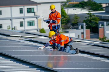 One of technician worker touch to check and maintenance solar cell panels and other co-worker hold...