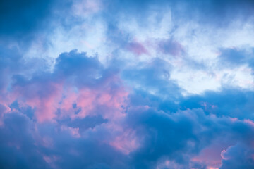 Blue morning sky is in pink clouds. Sunrise clouds are in vanilla colours. Beauty in nature. Twilight time, golden hour. Details of evening sunset. Natural abstraction. Peace concept. Panoramic view