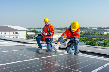 Caucasian technician workers use screwdriver to maintenance and fix the problem of the solar cell...