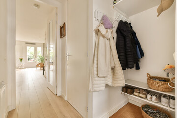 Empty hallway with coats and shoes at home