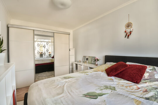 White bedroom with bed and closet