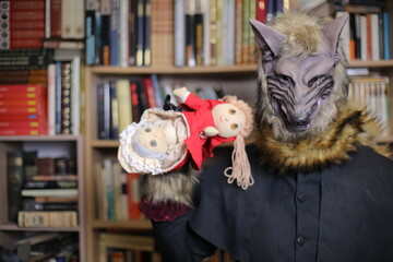 Wolf holding little red riding hood themed doll 