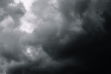 Dramatic sky with grey clouds. Thunderstorm before rain. Black clouds. Nature abstraction. Dark stormy background. Windy weather. High quality photo