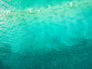 Serene ocean water view from above, photo taken by drone of the ocean, crystal clear waters of the...