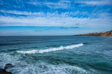 Store enrouleur  Waves crashing on the coast of Ericeira, Portugal. Scenic view of the Atlantic Ocean under a partly cloudy sky. Perfect for travel or surfing themes  © ricardo rocha