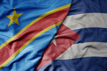 big waving national colorful flag of cuba and national flag of democratic republic of the congo .