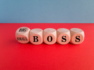 Turned a cube and changes the words small boss to big boss or vice versa. Beautiful red table, blue...
