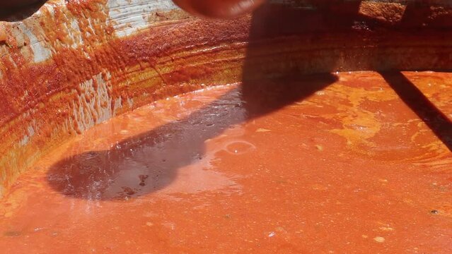 Tomato soup with pasta is a dish of Polish cuisine. Hot Zupa pomidorowa in a large cauldron at the field kitchen at a food fair. A popular soup made from grated tomatoes in their own juice.