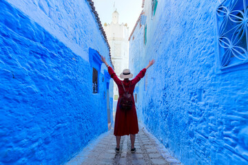 Chefchaouen town in Morocco, known as the Blue Pearl, famous for its striking blue color painted medina buildings and streets, creating a unique and magical atmosphere. - obrazy, fototapety, plakaty