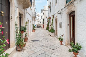 Characteristic narrow streets in the Locorotondo, metropolitan city of Bari, in Puglia, Italy