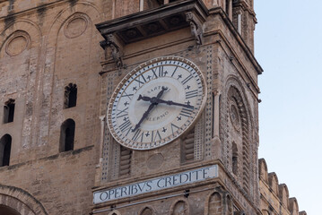 Fototapeta na wymiar Historical Ancient Clock On The Facade Of The Cathedral of Palermo In Italy