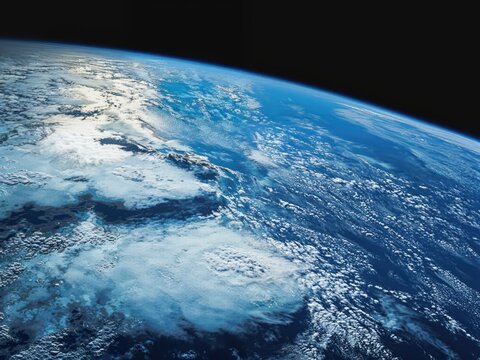 The earth seen from space with huge clouds over the sea