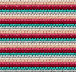 Geometric volumetric seamless knitted pattern in the form of bumps. The texture is crocheted from multi-colored yarn. Complimentary color combination.
