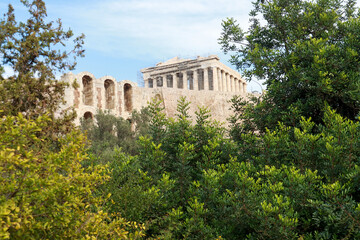 Fototapeta na wymiar View of part of the Odeon of Herodes Atticus Theater foreground and the Parthenon in background